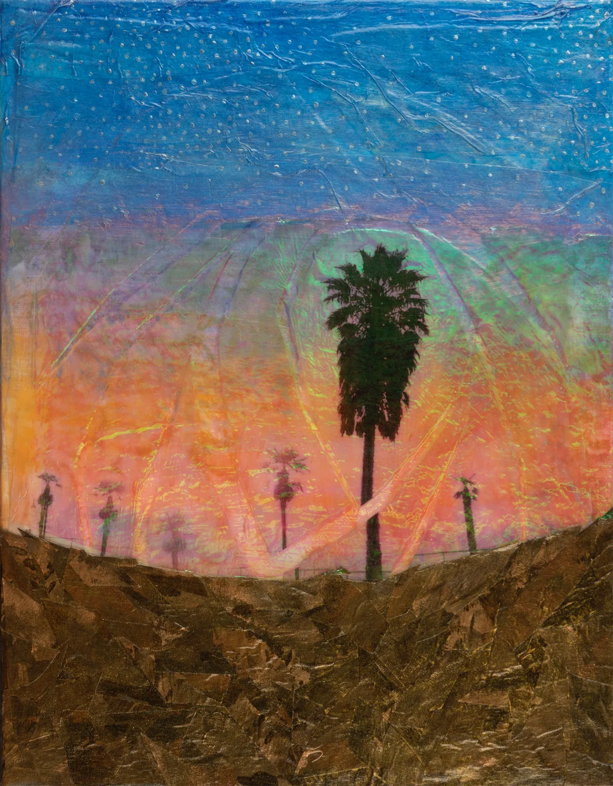 Palm silhouette against a sunset sky