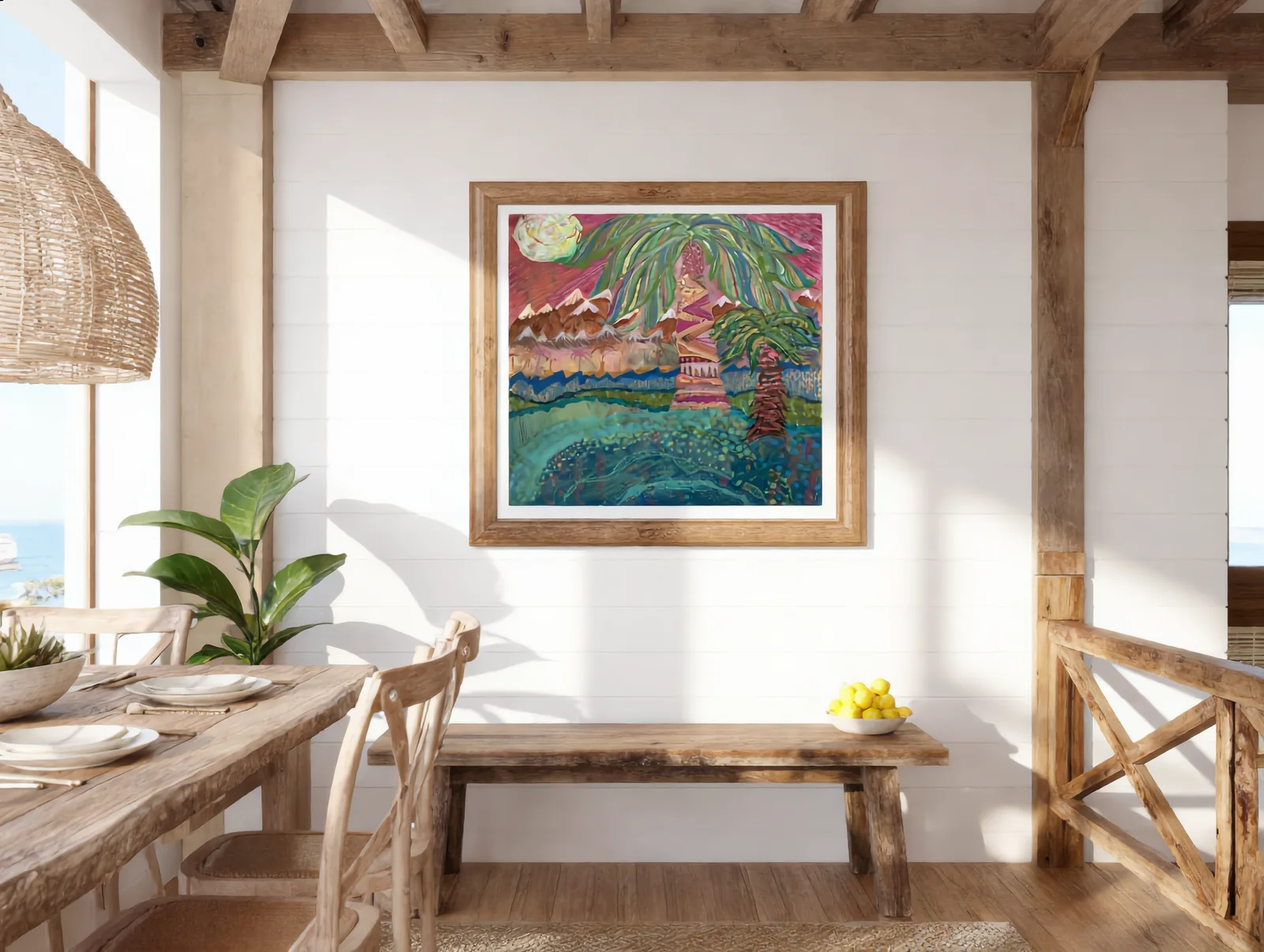 Landscape painting in an oak frame above a bench in a coastal dining room